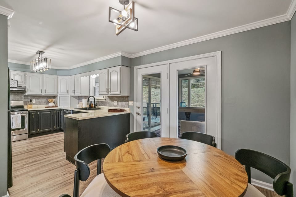 Bright dining area with modern kitchen and easy access to outdoor living