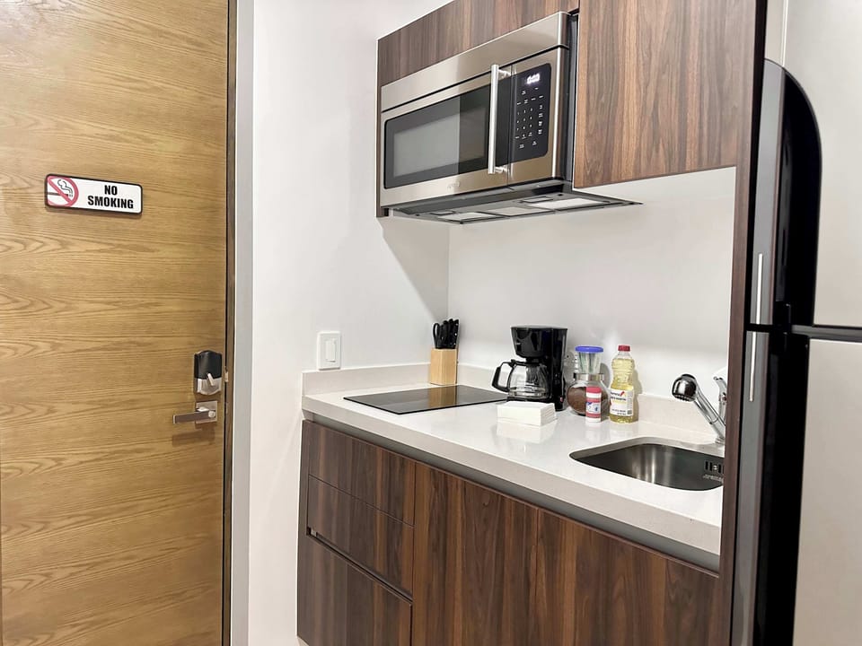 Fully equipped kitchenette with microwave, fridge and coffee maker for self-catering