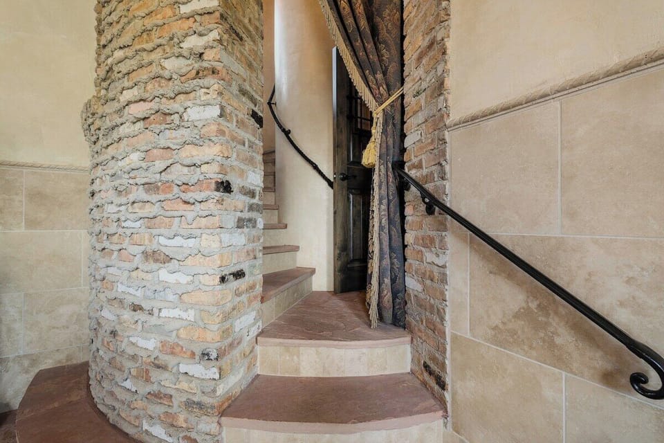 Stone spiral staircase winding up the estates central turret