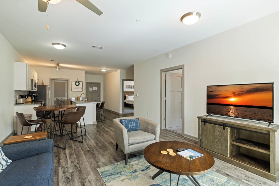 The living room flows seamlessly into the dining and kitchen areas, making it easy to stay connected with family and friends.