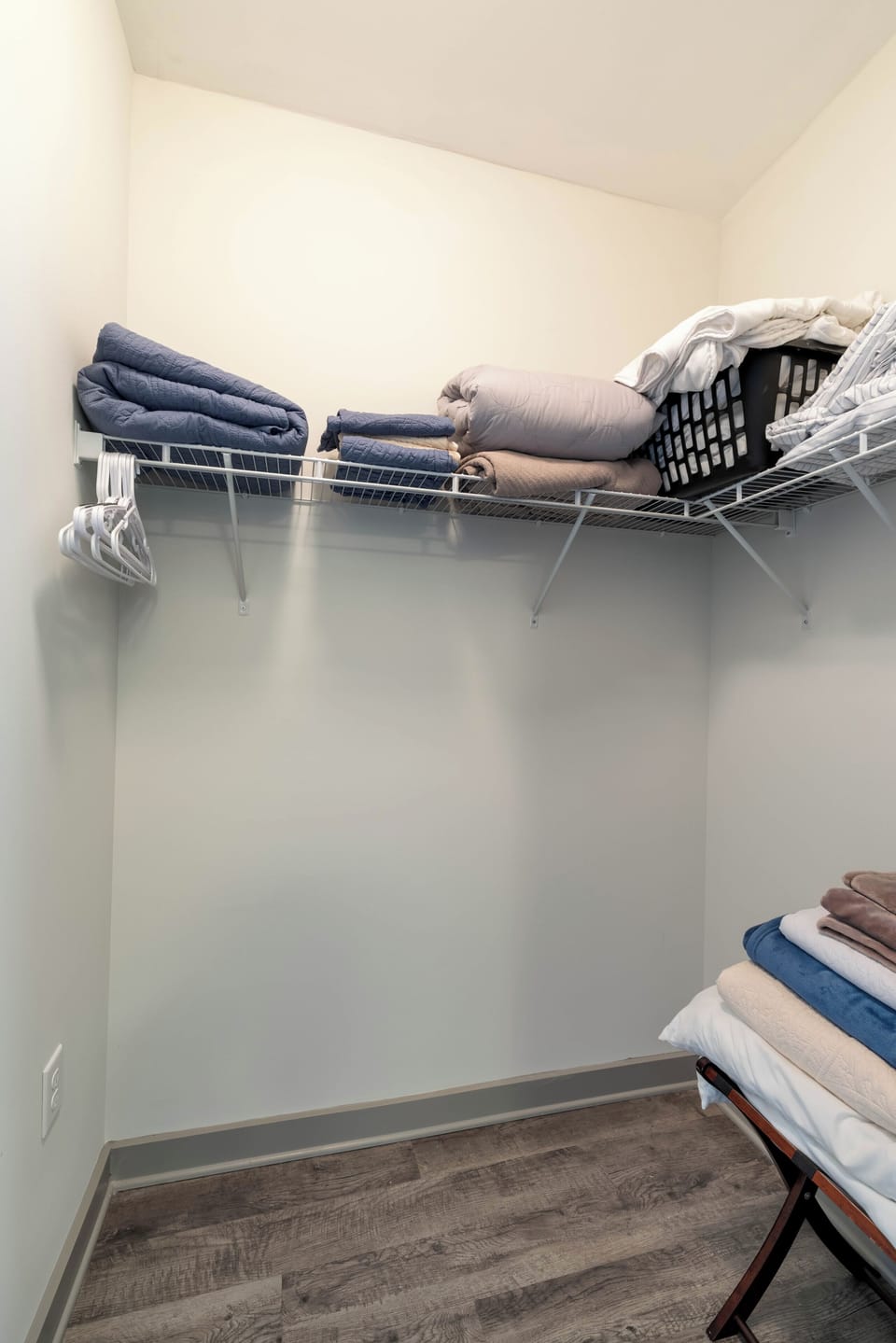 Enjoy the convenience of the attached walk in closet with plenty of space to unpack and store your belongings, plus additional linens available for your comfort during your stay.