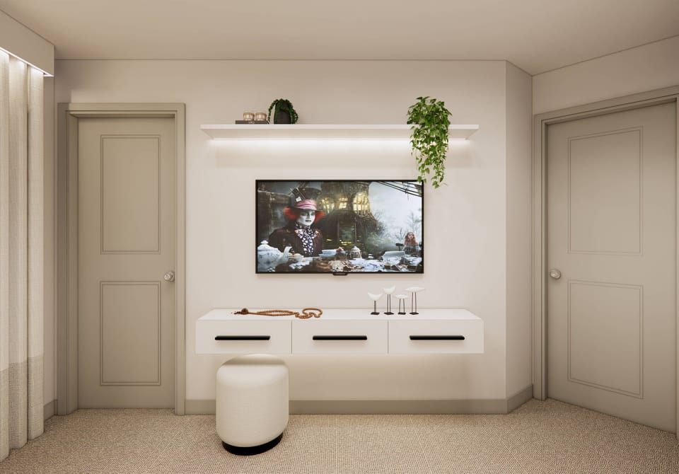 Experience a bright and airy living area with a sleek white media console and light walls. Enjoy cozy evenings in front of the mounted TV, surrounded by soft neutral tones and a touch of greenery for warmth.