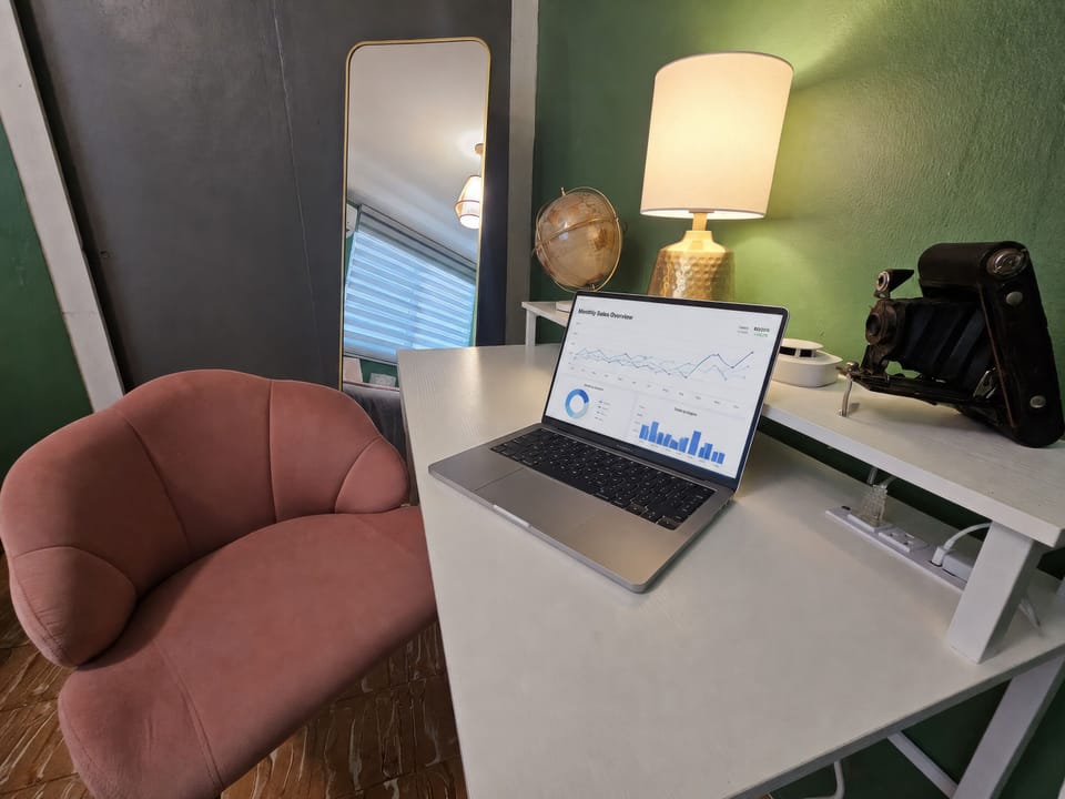 Chic work nook with cozy chair, warm lighting, and stylish decor