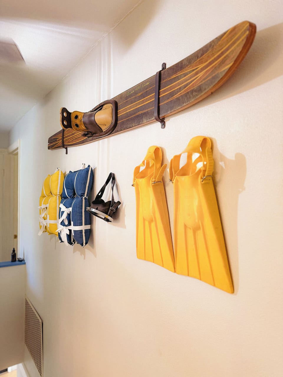 Playful vintage lake-inspired decor adds charm to the hallway
