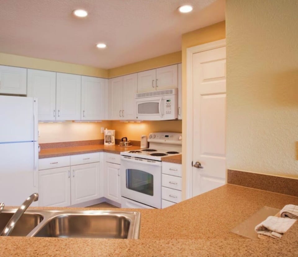 Full kitchen equipped the dishes and glasses and silverware & cooking utensils