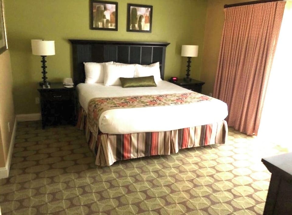 Master bedroom with King bed & full bathroom attached and oversized bathtub.