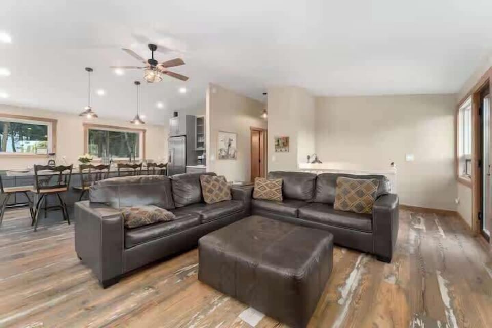 Open living room with sectional seating and easy flow to the dining area