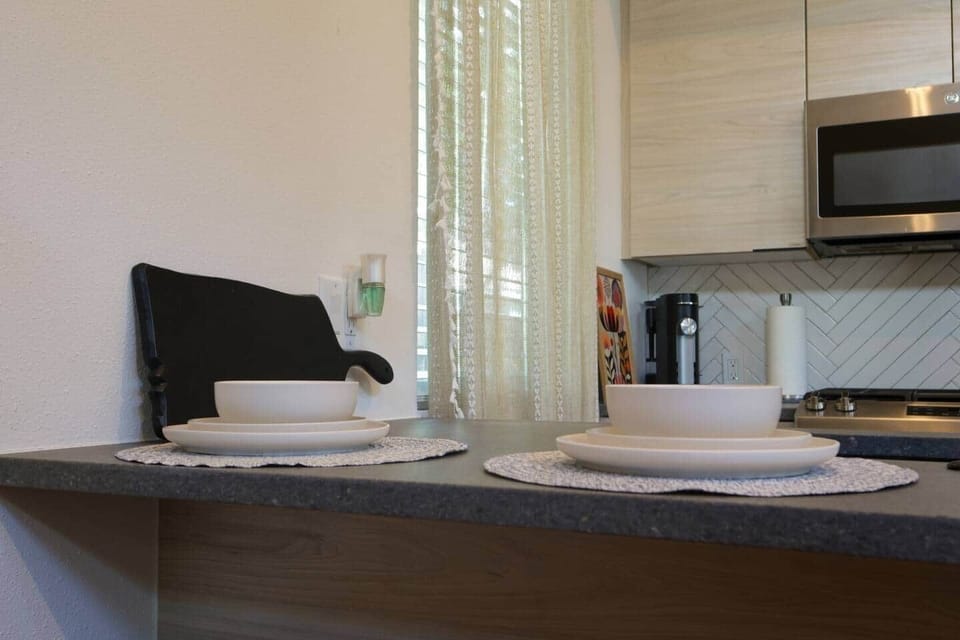 Breakfast bar with seating for four, ideal for coffee, quick meals, or remote work.
