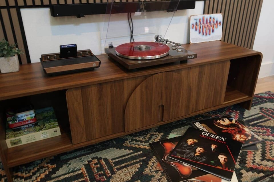 Enjoy a unique Austin vibe with a Bluetooth record player and vintage Atari gaming system for a relaxing evening indoors.