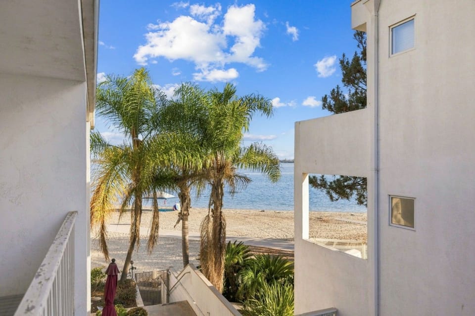 Step onto the balcony and take in sweeping views of Sail Bay — the kind of view that makes mornings here unforgettable.