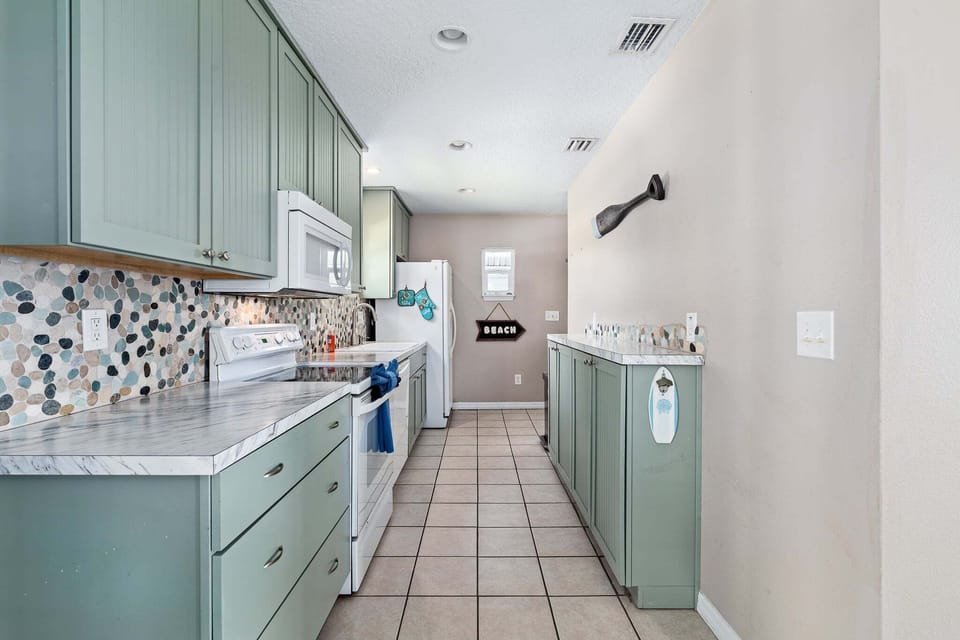 The open layout connects seamlessly to the dining area, making mealtime easy and enjoyable.