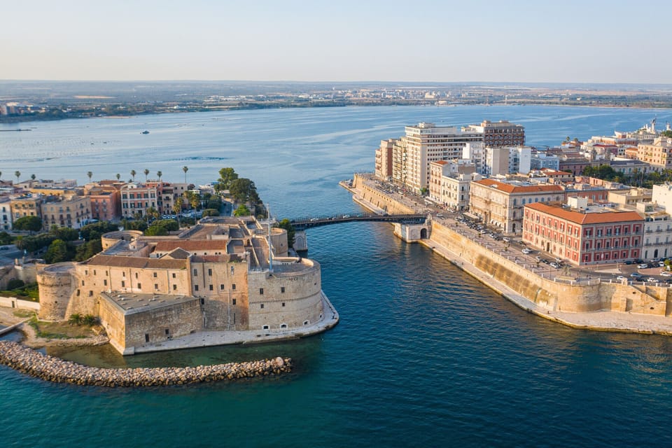 Aerial view of the Aragonese castle (Castel Sant'Angelo), and Bridge of San Francesco di Paola, also known as Ponte Girevole (Swing Bridge), in the historic center of Taranto