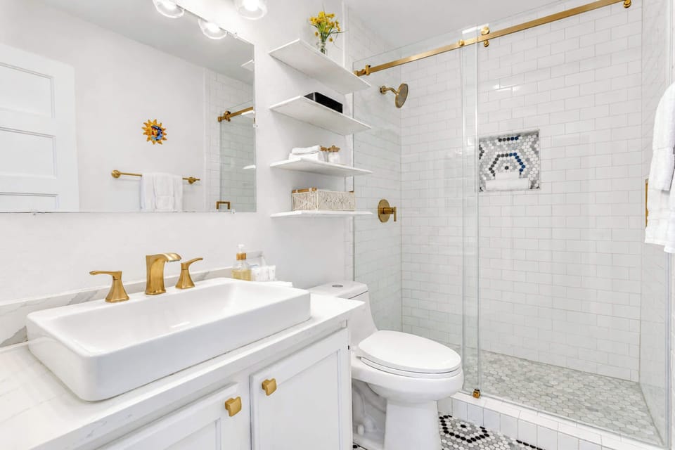 Guest bathroom w/ single vanity & walk-in shower