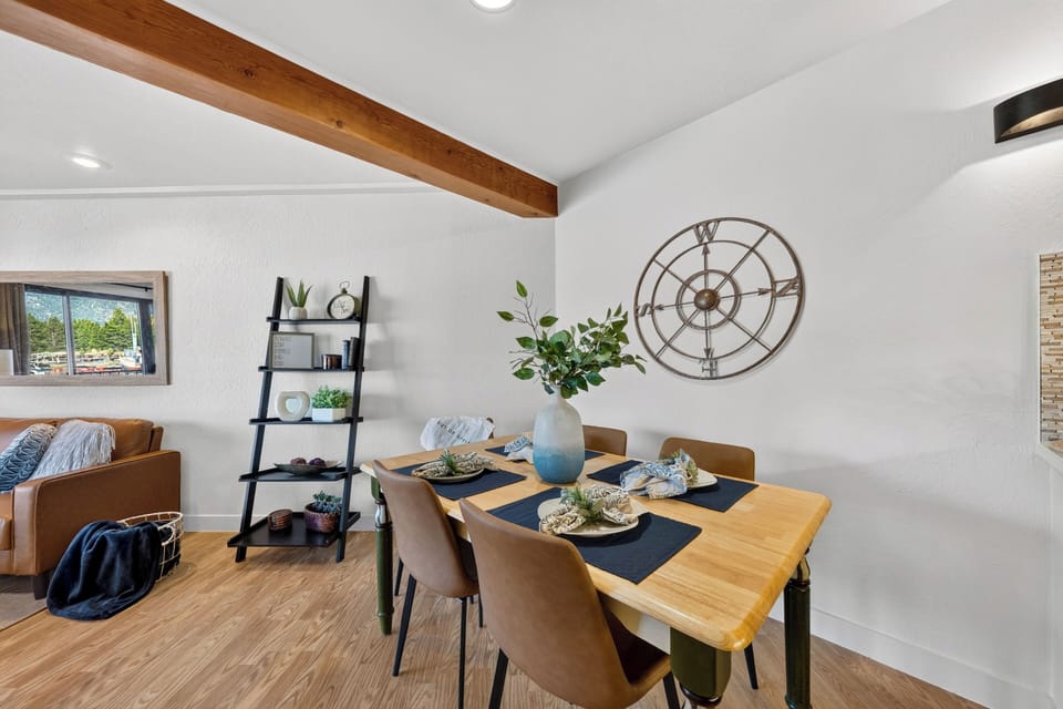 Dining nook set for four, positioned just off the living area for easy meals between lake outings.