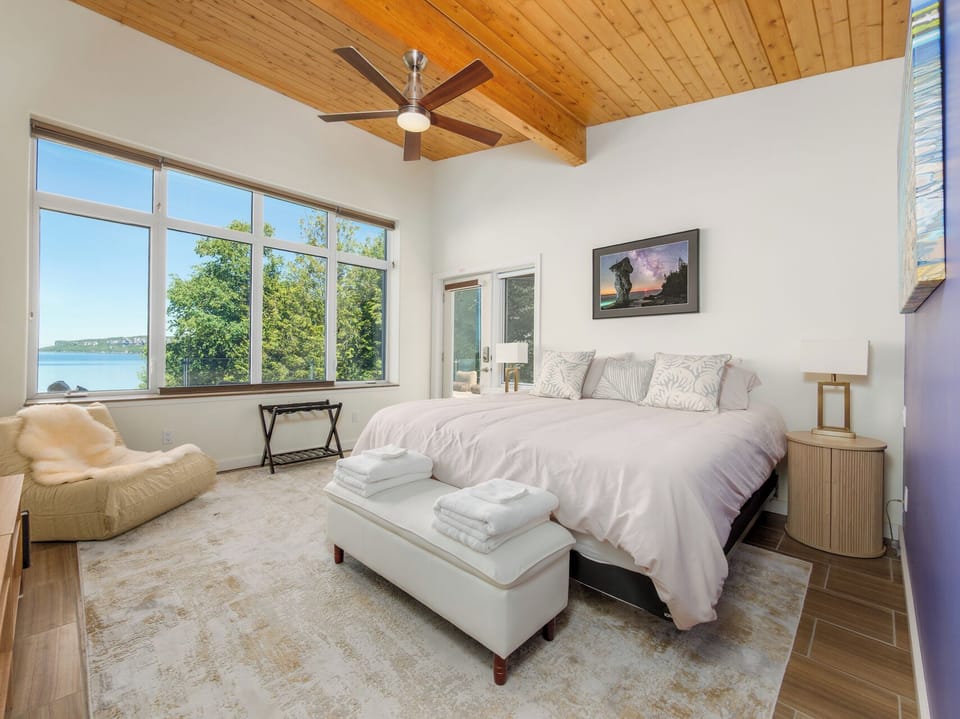 Wake up to stunning Georgian Bay views from the comfort of the spacious primary bedroom.