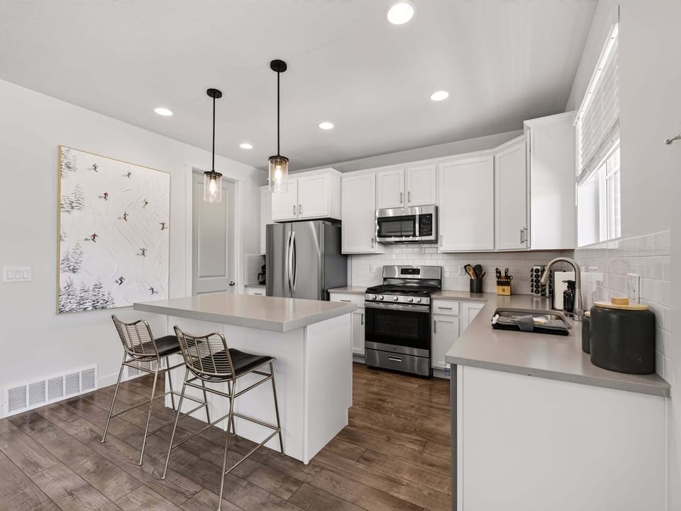 New Stainless Steele appliances, lots of counterspace and an island with additional seating