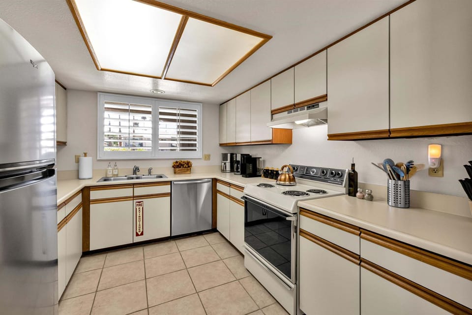 Fully equipped kitchen with ample cabinets and full-size appliances