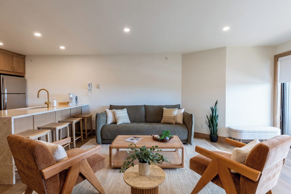 The living room has plenty of comfortable seating for up to four people.