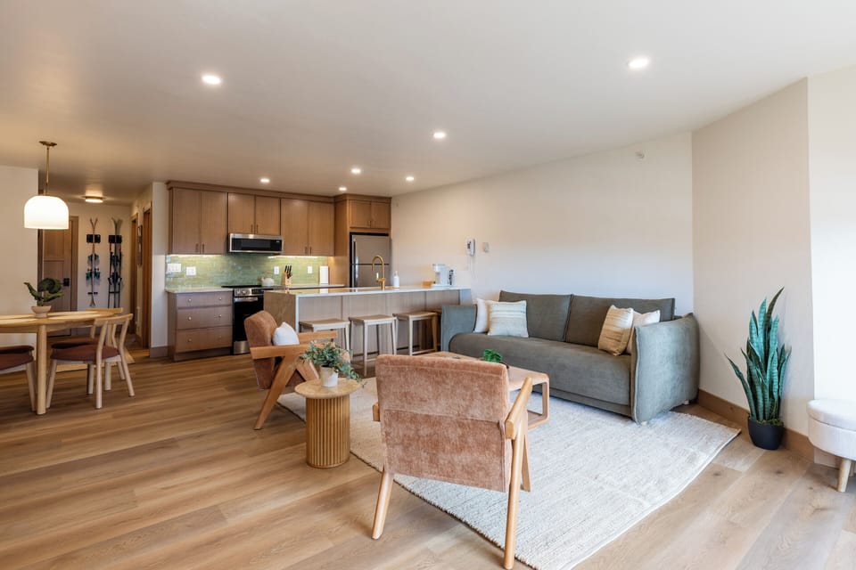 Our open floor plan with cozy couch and mood lighting provides the perfect spot to hang after a day on the mountain.