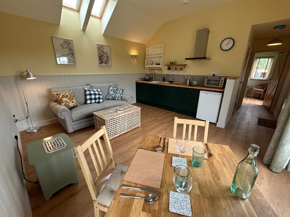 No. 1's spacious living room and lounge feature an open-plan kitchen and dining area, creating a welcoming space for relaxation and socialising.