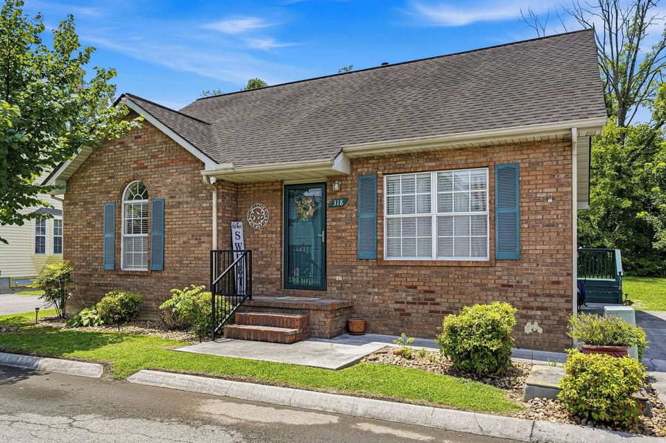 A charming brick home with inviting curb appeal awaits your arrival. Classic architectural details and lush landscaping create a welcoming atmosphere from the moment you arrive.