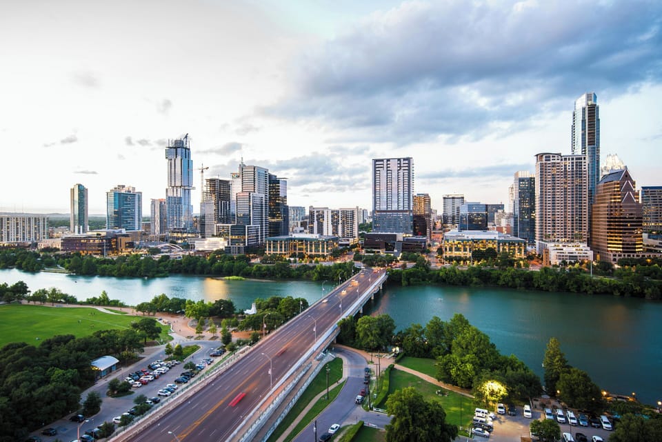 Panoramic downtown skyline and river views near trails, dining, nightlife