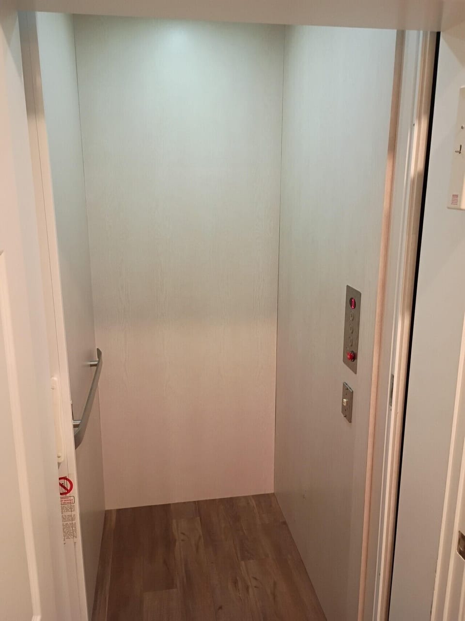 Cleverly concealed behind the door is an elevator.