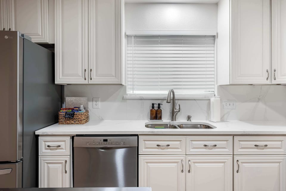 Clean white kitchen with everything you need for easy meals.