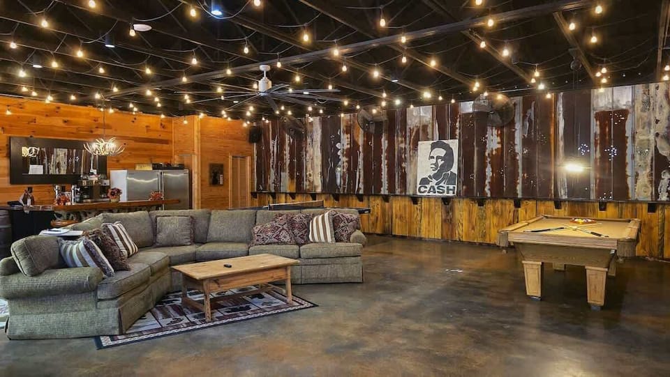 The Lodge is 1200 square feet (40x30).  Pool Table, Ping Pong, Awesome Teak Bar, 90" TV, Music System, Commercial Refrigerator & Freezer, Acid Stained Concrete Floors, & 2 Large Bathrooms with Walk-in Showers.