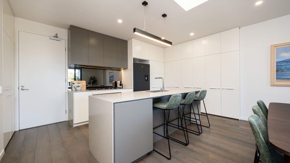 Contemporary kitchen with a breakfast bar and comfortable seating