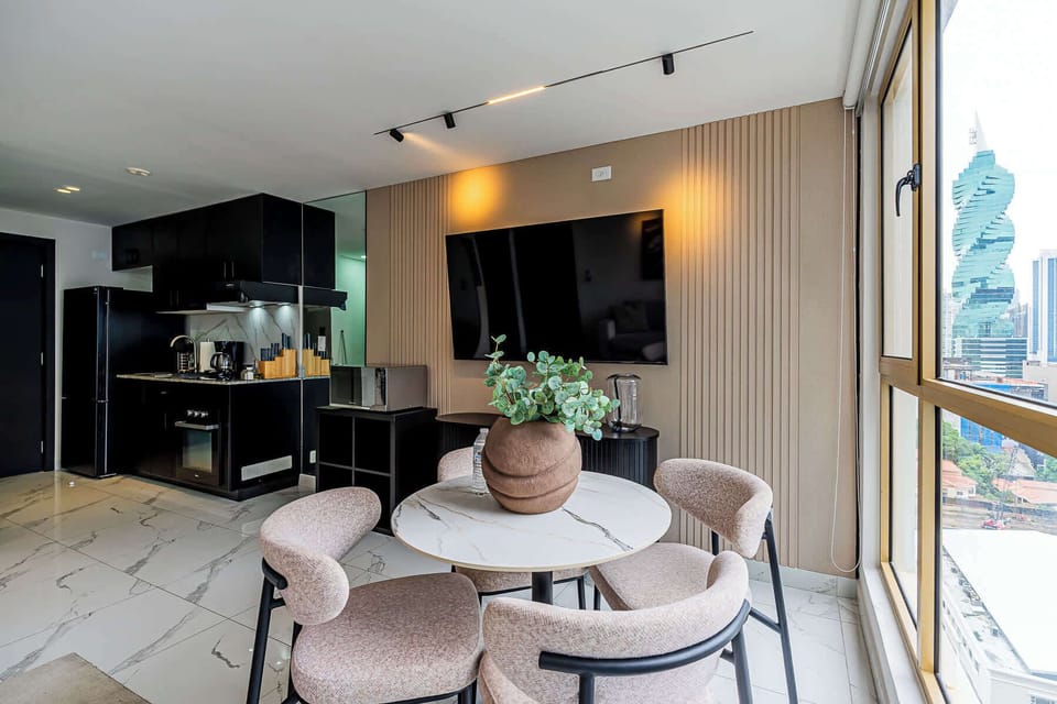 Dining area with abundant natural light and skyline views.