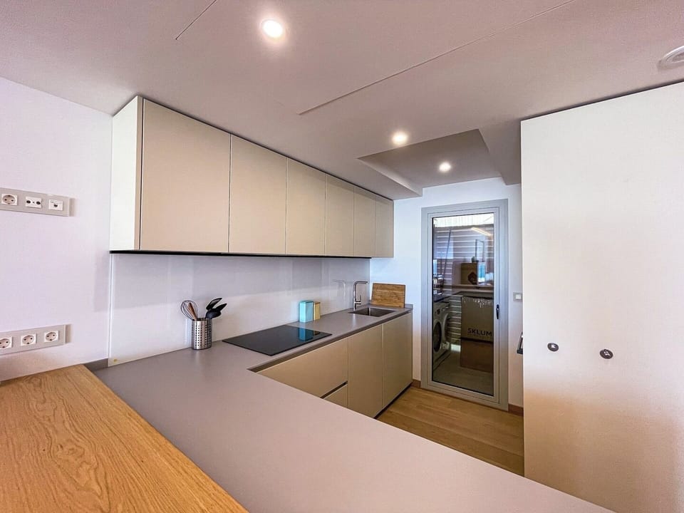 In this stylish kitchen you will find everything you need, the door leading to the laundry room.