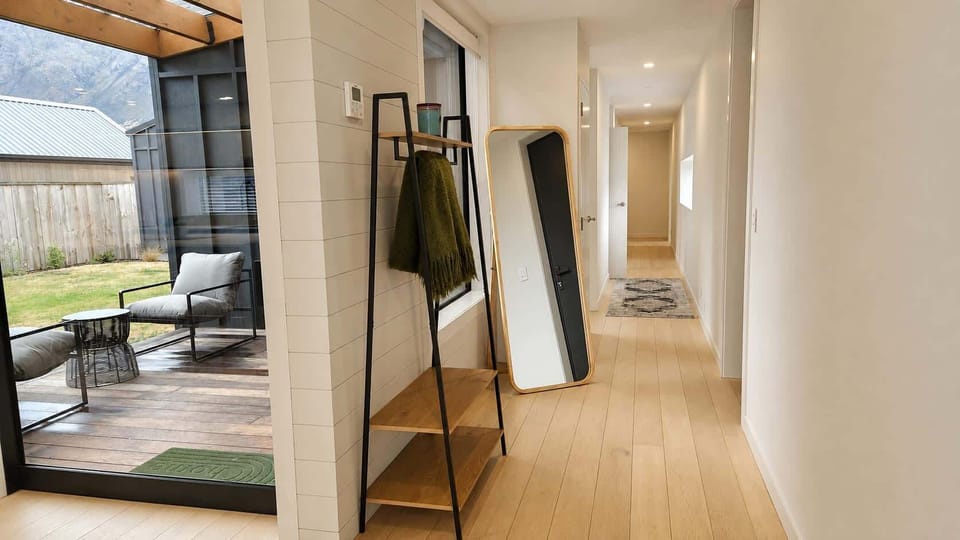 Entry Hallway leading to bedrooms, garage and main bathroom 