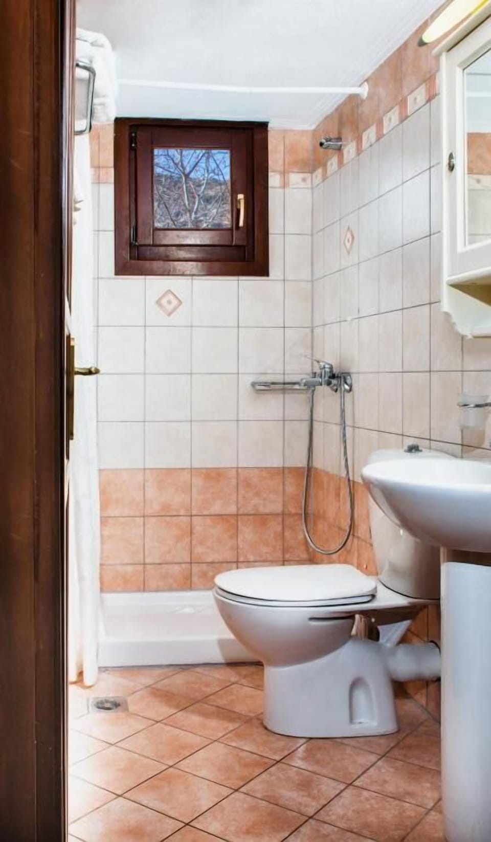 Bright and impeccably maintained bathroom with modern amenities, fresh towels, and everything you need to begin or end your day in comfort.