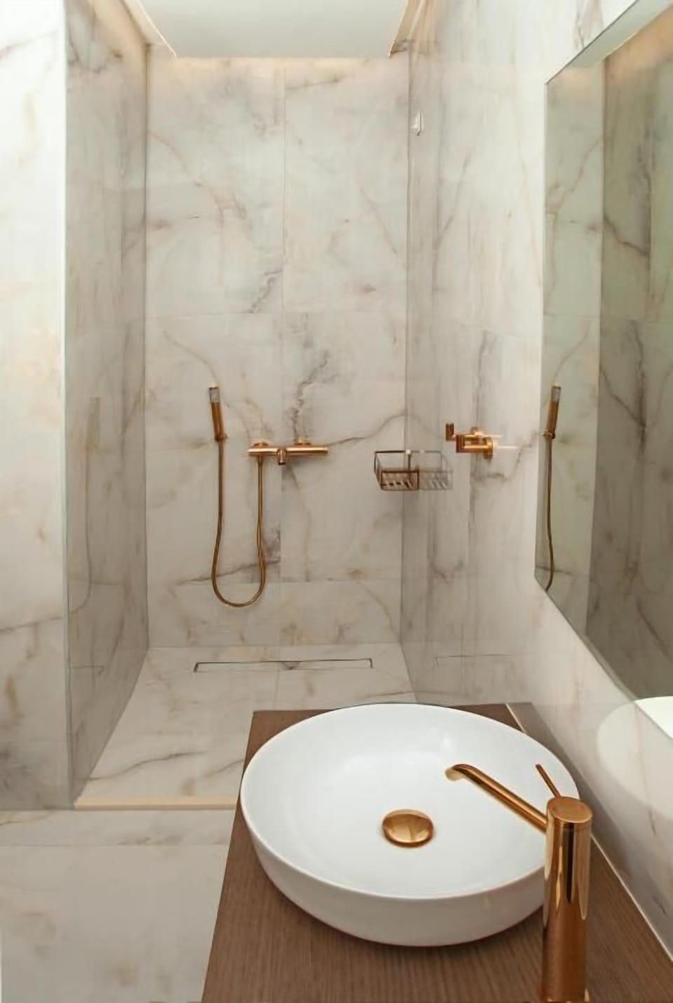 Contemporary bathroom with a spacious walk-in shower, fresh towels, and complimentary toiletries for your comfort.