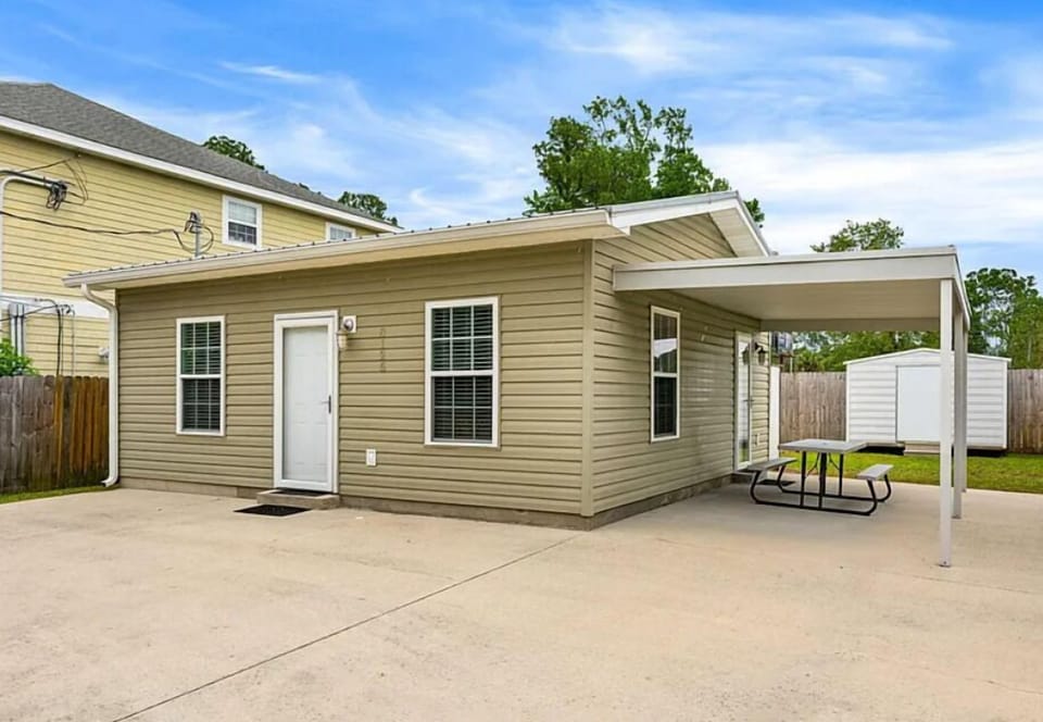 A quiet vacation home in a peaceful residential neighborhood, offering private outdoor space and easy parking for your getaway.