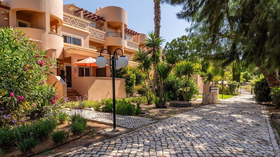 Stroll through the beautifully maintained gardens and along charming cobblestone paths that lead to your welcoming apartment, enveloped by vibrant greenery and a tranquil atmosphere. The inviting outdoor spaces truly enhance your holiday experience, offer