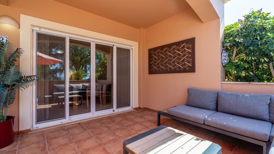 Enjoy leisurely afternoons and charming evenings on your private outdoor patio, featuring comfortable seating perfect for alfresco dining or simply soaking up the sun. The seamless transition indoors makes this a fantastic extension of your living space.
