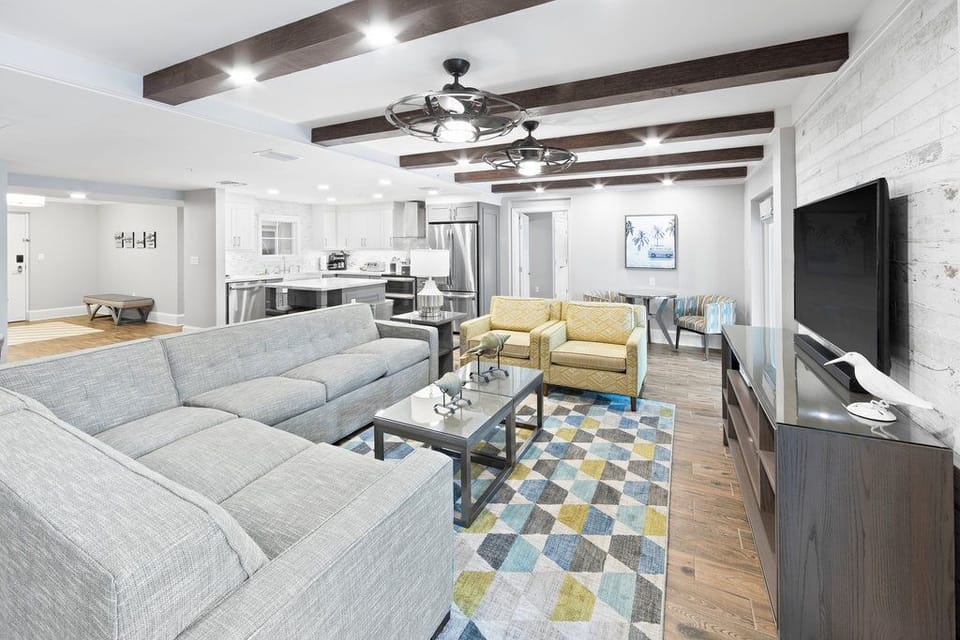Spacious living room with plush seating and an open layout, perfect for gathering with family and friends.