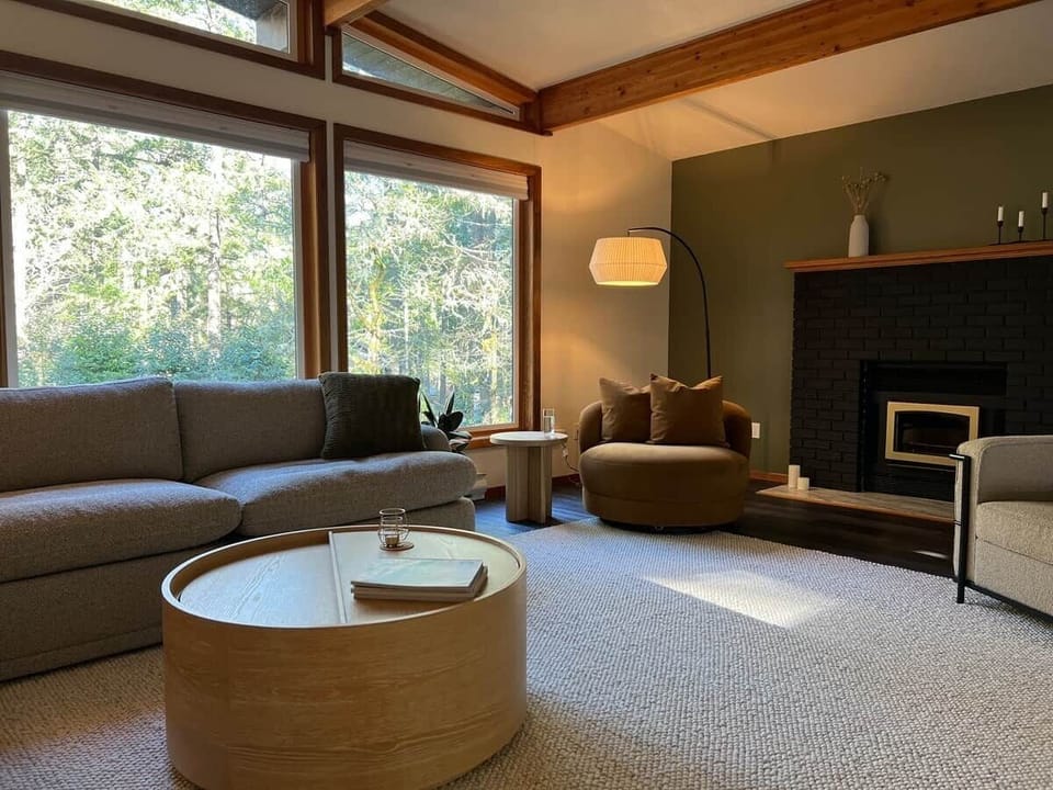 Find your perfect spot to relax: whether it's sinking into the oversized plush sectional, cozying up on the velvet swivel chair, or stretching out on the soft floor rug.