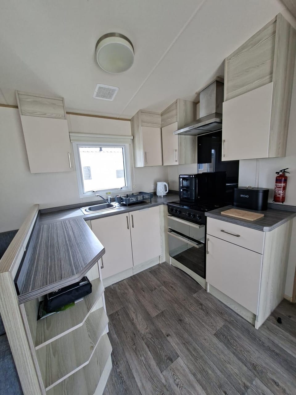 The open plan living style in this caravan is perfect to spend time as a family together in Wales.