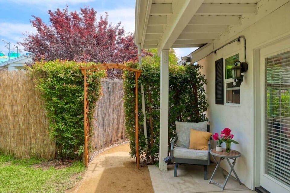 A charming backyard guest house wrapped in greenery, just steps from your own private entrance.