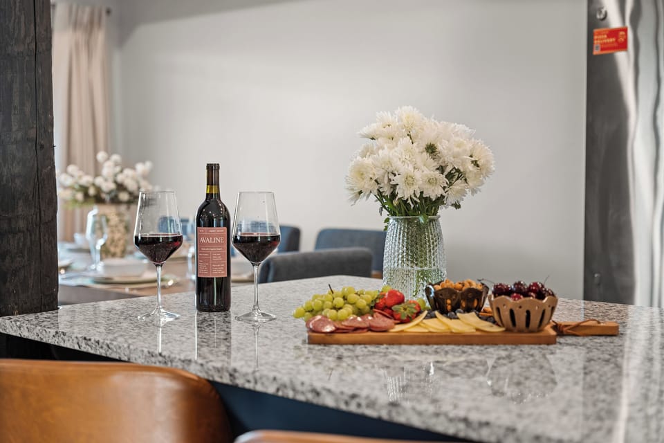 Pour a glass of red and build a charcuterie board on the granite island for a slow Ozark evening.