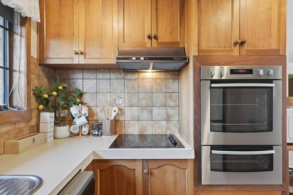 Modern kitchen featuring quality appliances and generous bench space.
