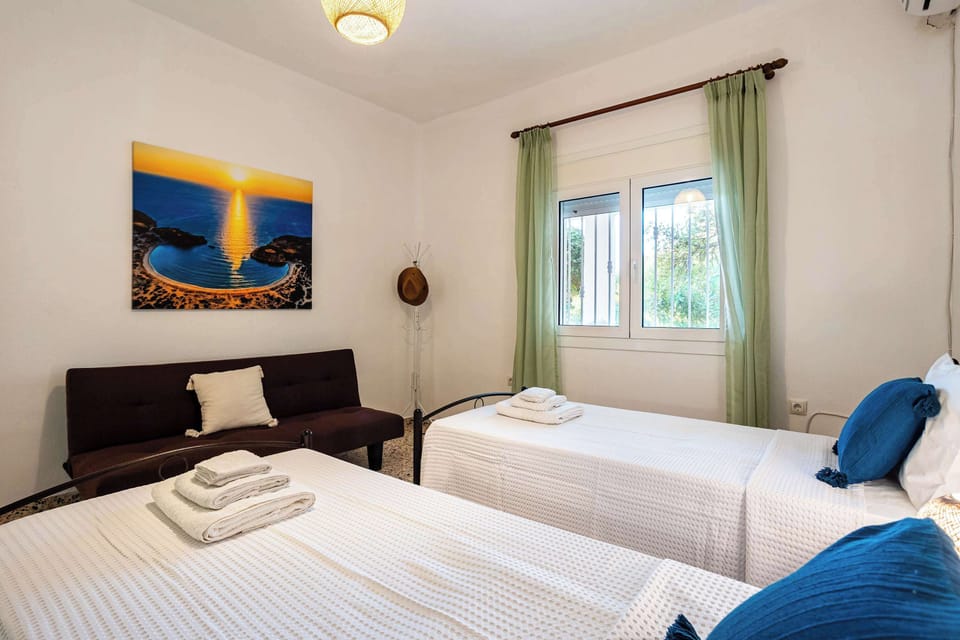Second Bedroom: Spacious room with flexible sleeping arrangements for families or groups.
