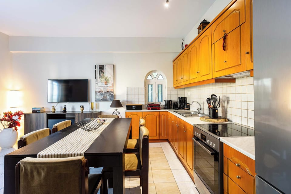 Well-equipped kitchen featuring modern appliances and generous counter space.
