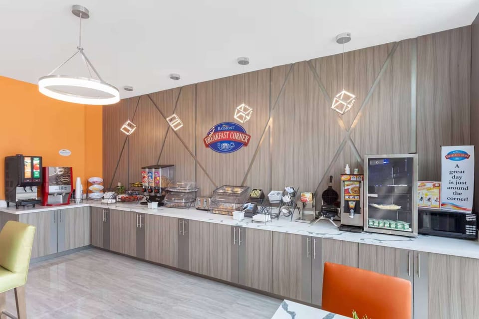 Breakfast area with fresh food, drinks, and seating