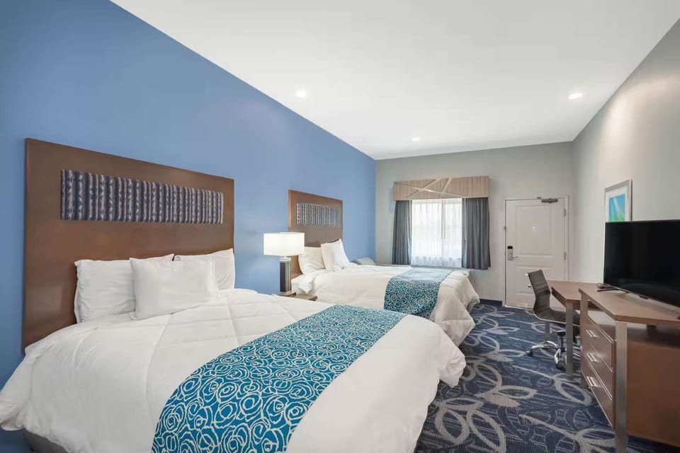 Bright room with two queen beds and work space