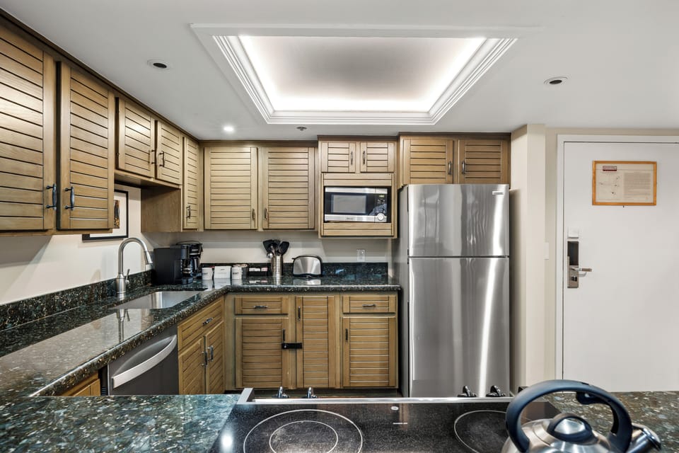 The well-appointed kitchen features stainless steel appliances, generous counter space, and everything you need to prepare meals for family and friends.
