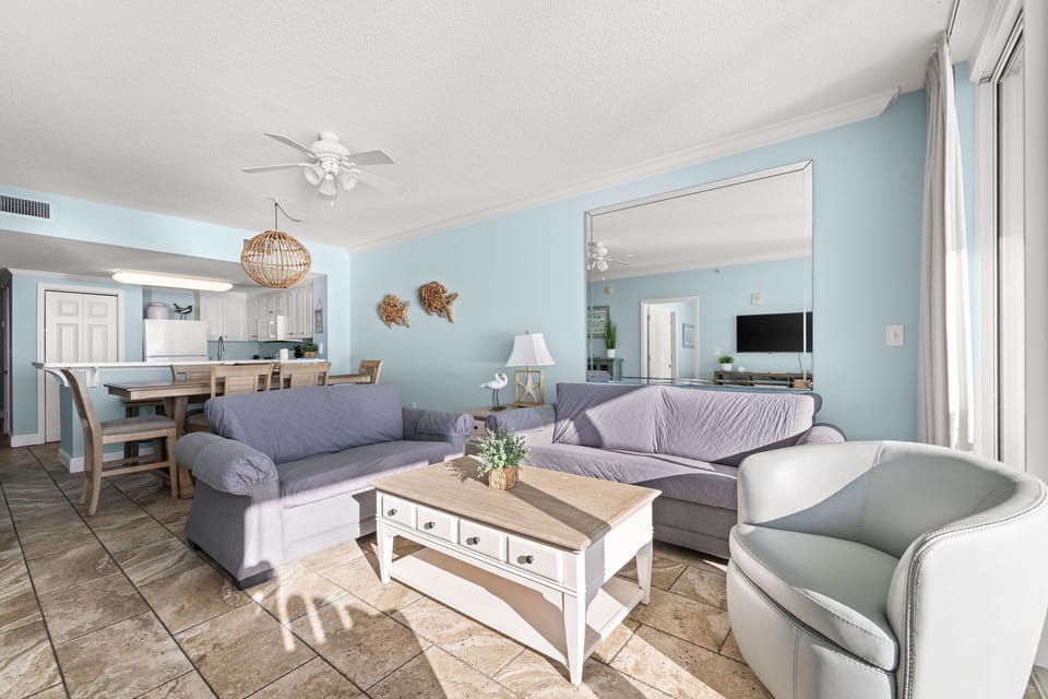 Relax in this bright living room with coastal-inspired decor and comfortable seating.